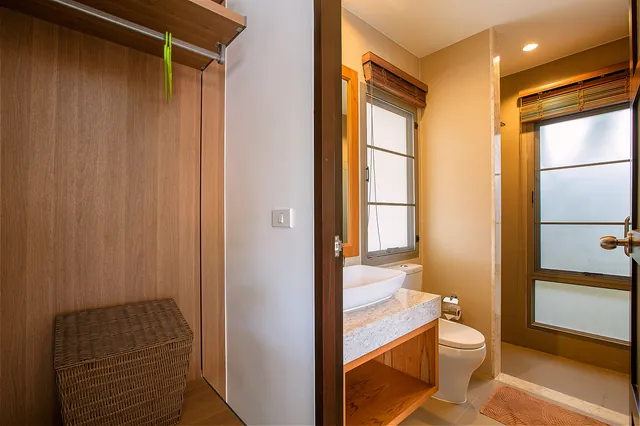 Bathroom: vanity, window and shower entrance