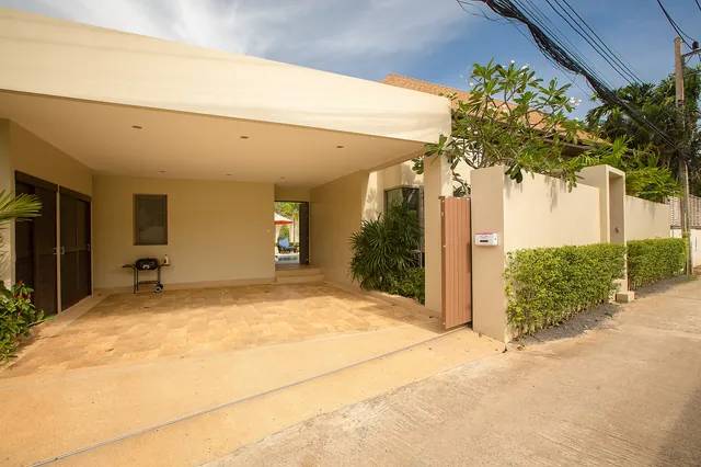 Driveway entrance: covered parking and gate