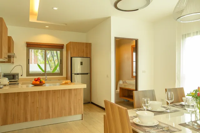 Kitchen with breakfast bar and dining area