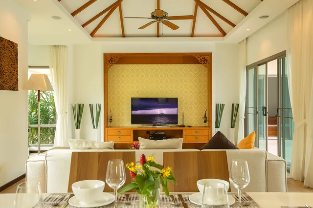 Living room with TV and vaulted ceiling