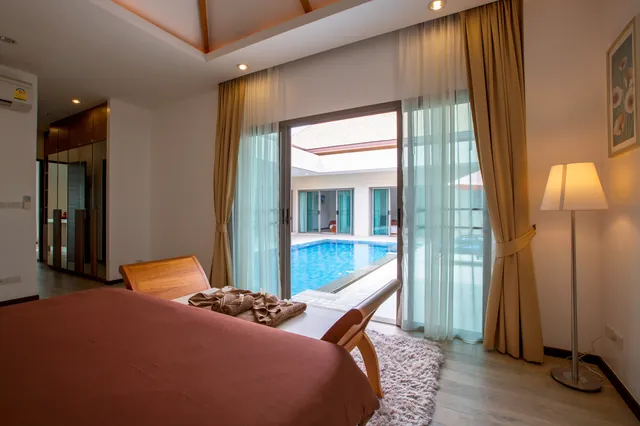 Bedroom opening to the pool