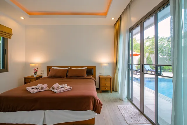 Bedroom with pool view